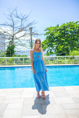 Caucasian woman in pool area on vacation
