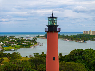 Jupiter Inlet Lighthouse Beacon: Capture the timeless charm of the historic Jupiter Inlet Lighthouse, a beacon of maritime history against a backdrop of a serene seascape. © Mark