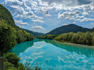 Soca Valley, Slovenia &ndash; Aerial view of the emerald-green Alpine River Soca on a bright sunny summer day with green foliage..The last wild river in Europe in Triglav National Park near the Vricic Pass