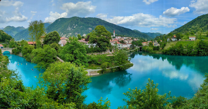 Soca Valley, Slovenia &ndash; Aerial view of the emerald-green Alpine River Soca on a bright sunny summer day with green foliage..The last wild river in Europe in Triglav National Park near the Vricic Pass