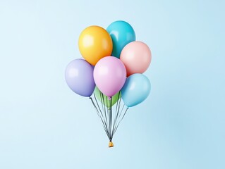 Obraz premium Colorful balloons floating against a light blue background, creating a festive atmosphere