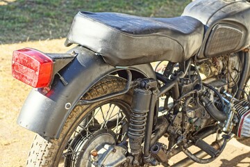 back with soft leather saddle fender with red plastic stop signal and wheel with tire and spokes...