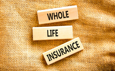 Whole life insurance symbol. Concept words Whole life insurance on beautiful wooden blocks....