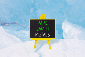 Rare earth metals symbol. Concept words Rare earth metals on beautiful blackboard. Beautiful blue...