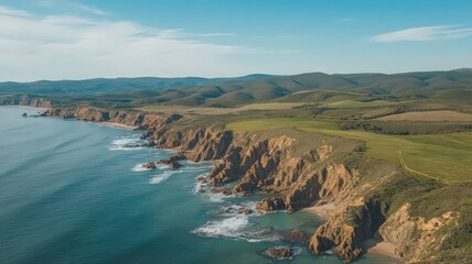 Fototapeta premium Aerial View of Dramatic Coastline with Red Cliffs and Lush Green Vegetation