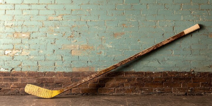 Vintage Hockey Stick Leaning Against Rustic Brick Wall, Sports Memorabilia, Texture