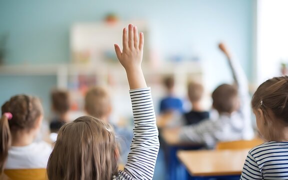 Attending school concept,cheerful kids in school in classroom giving attendance