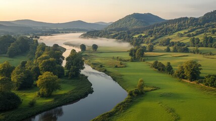 Fototapeta premium Aerial View of Serene River Valley at Sunrise