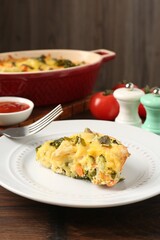 Tasty vegetable casserole on wooden table, closeup