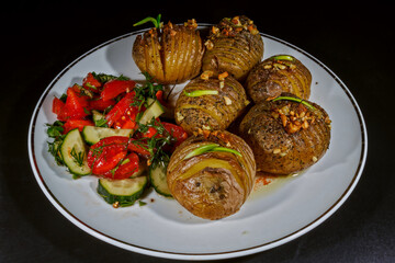 Crispy baked hasselback potatoes with fresh salad