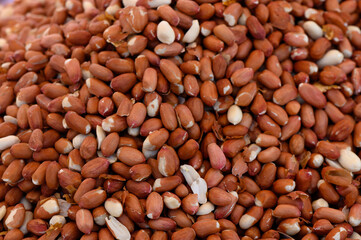 Pile of fresh raw peanuts ready for culinary adventures at a vibrant market