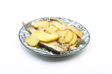 Baked fish dish with potatoes.