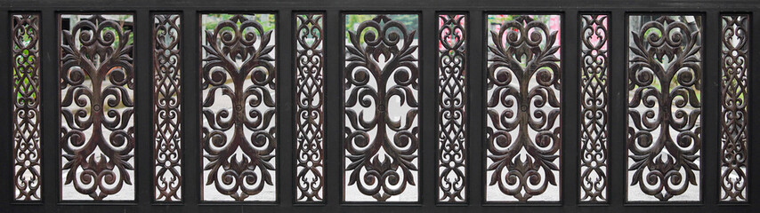 A row of wooden fences decorated with patterns and details
