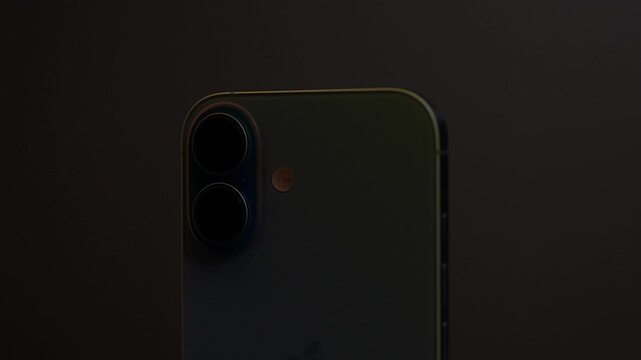 Moscow, Russia - March 15, 2025: Iphone 16 in the multicolored light