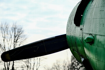old green plane with propeller