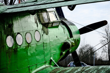 old green plane with propeller