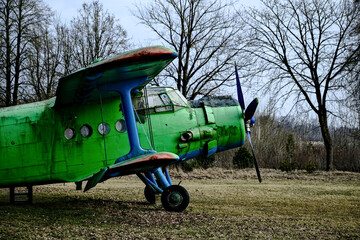 old green plane with propeller