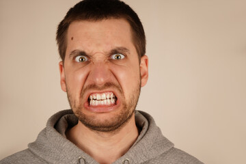 The image captures the power of his emotional outburst. A close-up of a man's face in intense...
