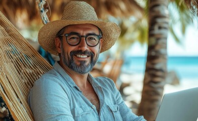 Middle-aged woman with a joyful expression works on her laptop while relaxing in a hammock at a tropical beach, surrounded by palm trees