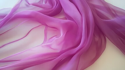 Obraz premium Elegant Purple Silk Fabric Draped on White Background