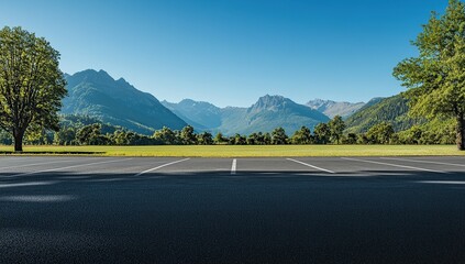A wide-angle photograph of an empty parking lot with black asphalt,