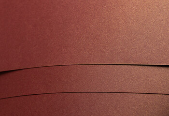 Rich burgundy paper texture with a pearlescent shimmer and glossy finish. Elegant and metallic...