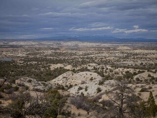 Beautiful view of Farmington New Mexico desert landscape with dramatic clouds and La Plata Mountains in winter