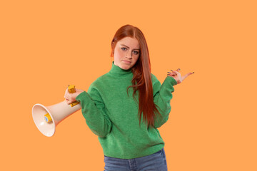 Young woman in green sweater holds megaphone and makes puzzled expression against orange background