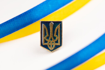 National symbols of Ukraine: golden trident and yellow-blue flag. Pattern for greeting card.