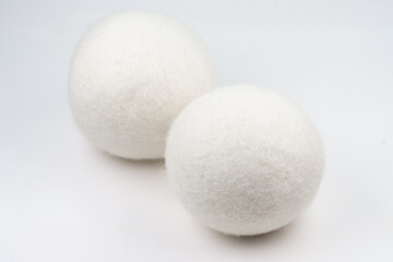 Wool dryer balls on white background.