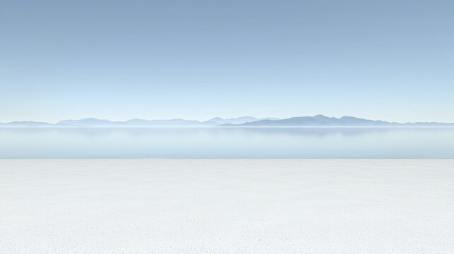 A serene landscape of a calm body of water, mountains, and a sandy beach.