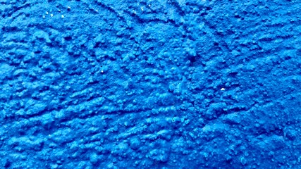 a concrete cement with blue brush paint
