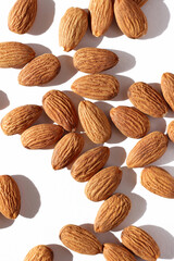 Almonds. Closeup of Almond Nuts Arranged on White Background.