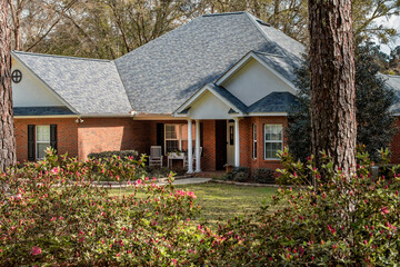 North Florida Residential Colonial Brick House with Blooming Azaleas