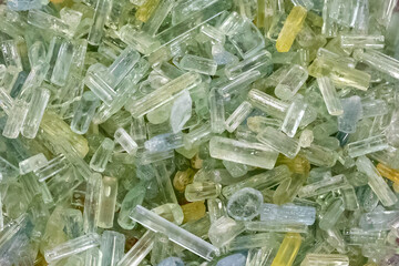 collection of rough and polished beryl or aquamarine gemstones
