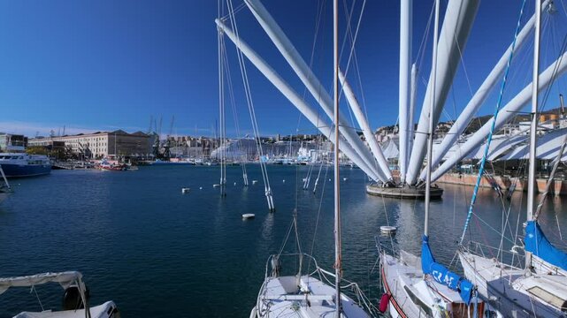 The Porto Antico in Genoa features the iconic Bigo crane, sailboats, and a scenic waterfront, blending history with modern design in this lively harbor area.