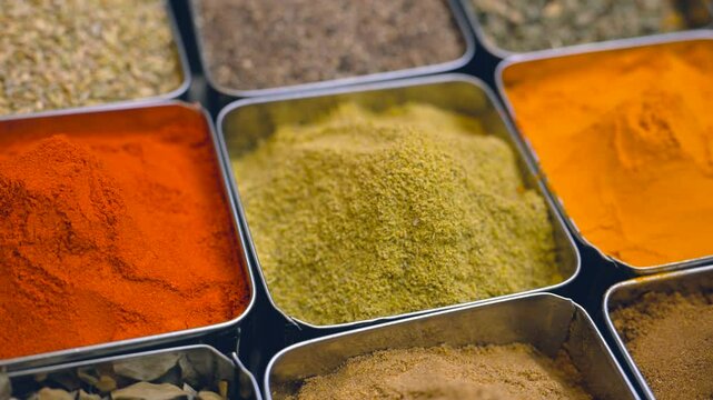 Spices. Various Indian Spices. Spice and herbs in a restaurant. Assortment of Seasonings, condiments. Cooking ingredients, flavor. 4K UHD video