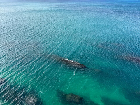 Aerial view on beautiful sea and underwater rocks.