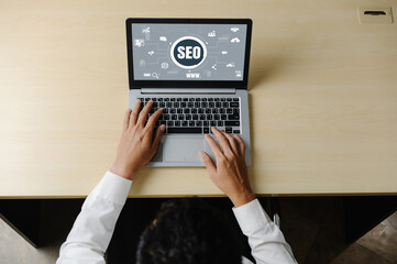 SEO search engine optimization for modish e-commerce and online retail business showing on computer...