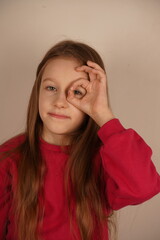 Fototapeta premium A little girl makes an 