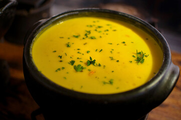 Sweet potato soup on wooden table. Healthy food