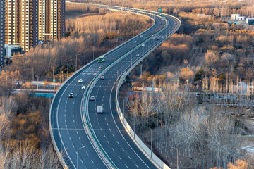 The winding viaduct in Beijing, China. The harmony between urban roads and nature. Jingping...
