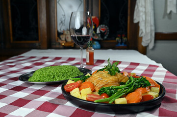 typical portuguese dish roasted codfish with onion garlic peppers and rustic babata lusitanian food
