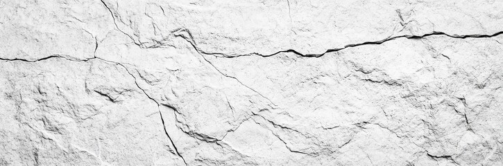 Obraz premium White rock texture. Light gray stone wall background with space for design. Cracked surface. Close-up.