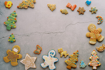 Colorful glazed cookies on a cracked concrete background