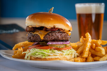 Bacon Cheeseburger with Fries and a Beer.