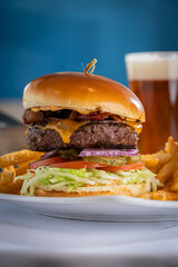 Bacon Cheeseburger with Fries and a Beer.