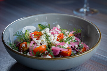 Beet Salad with Tomatoes, Feta and Dill with a glass of white wine.