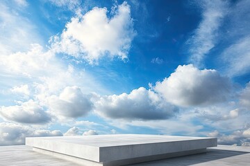 Fototapeta na wymiar Empty concrete platform under a vast blue sky with fluffy clouds