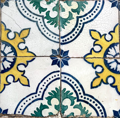 Close-up of a geometric tile pattern with blue, yellow, green and black colors